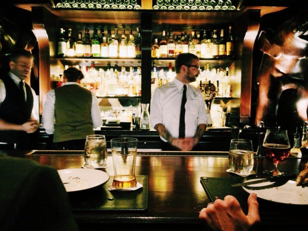 Bartenders serving in a bar